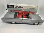 Nice Schuco #5505 Battery Operated Silver Cadillac De Ville Convertible W/ Box. Fixed Price $148.45.